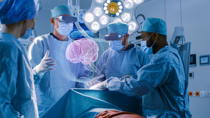 Surgeons Wearing Augmented Reality Glasses Perform Brain Surgery with Help of Animated 3D Brain Model, Using Gestures. High Tech Technologically Advanced Hospital. Futuristic Theme.