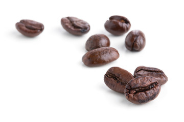 Roasted coffee beans isolated on pure white background for content using.