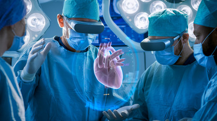 Surgeons Perform Heart Surgery Using Augmented Reality Technology. Difficult Heart Transplant Operation Using 3D Animation and Gestures. Interactive Animation Shows Vital Signs. Futuristic Hospital.