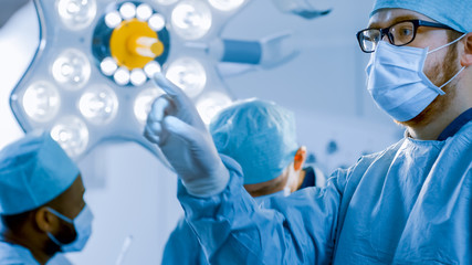 In the Operating Room Surgeon Gestures Using Augmented Reality Technology During Operation. In the...