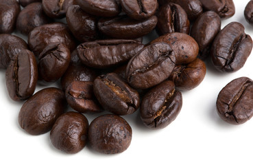 Roasted coffee beans isolated on pure white background for content using.