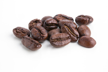 Roasted coffee beans isolated on pure white background for content using.
