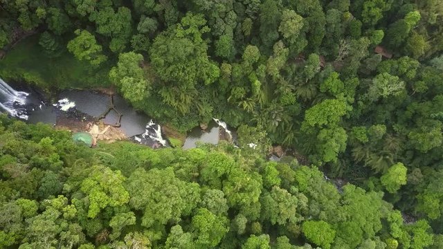 camera moves along highland gorge with waterfall