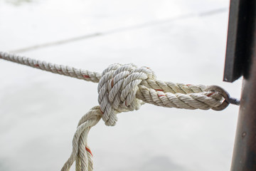 The rope knot's on the beach.