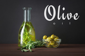 Bottle with olive oil on table