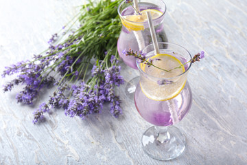Obraz na płótnie Canvas Glasses with fresh lavender lemonade on table
