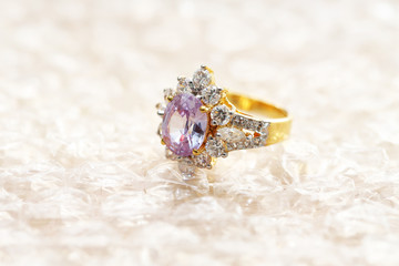 pink gemstone on diamond ring