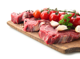 Fresh raw meat with spices and vegetables on white background