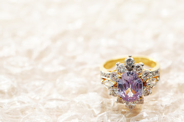 pink gemstone on diamond ring