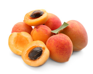 Ripe sweet apricots on white background