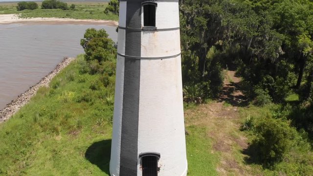 Top to bottom aerial of a lighthouse in a marsh found in south louisiana outside of new orleans