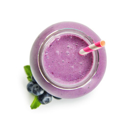 Fototapeta na wymiar Glass jar of tasty blueberry smoothie on white background, top view