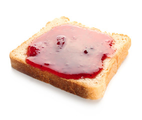 Slice of bread with delicious strawberry jam on white background
