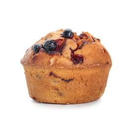 Sweet tasty muffin with berries on white background