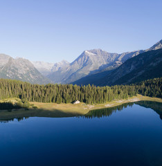 Fototapeta na wymiar Alpine lake in Valtellina. Palù lake in Valmalenco. Aerial photo