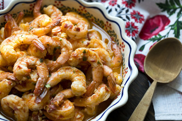 Appetizing shrimps cooked in spicy sauce with oil