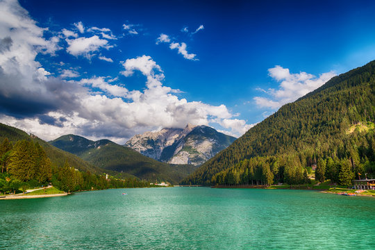 Dolomites, Italy. Beautiful alpine lake with mountain peaks in summer season