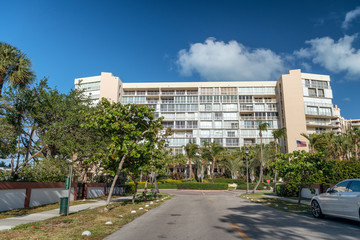 Key Biscayne buildings and boulevard on a sunny day, Miami