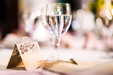 Naklejka na ściany i meble Wedding table with a place card and glasses