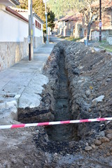 a deep ditch, a dug hole,