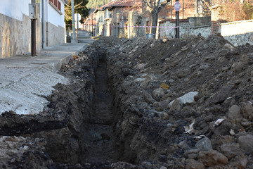 a deep ditch, a dug hole,