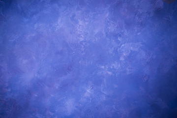 Blue lighted wall texture for designer background. Painted surface.