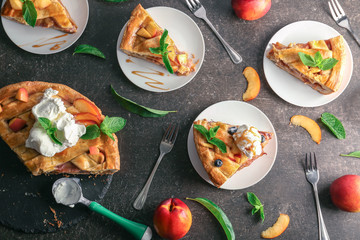 Composition with pieces of tasty homemade peach pie on table