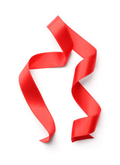 Curled red ribbon on white background