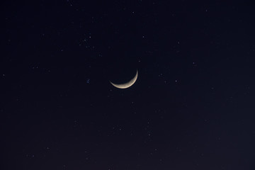 Fototapeta na wymiar Crescent moon in the dark night.