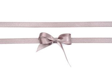 Silver ribbons with bow on white background