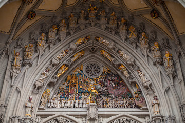 Fototapeta na wymiar Details of the Last Judgement placed over the main portal of Bern Minster, Switzerland. It is one of the most complete Late Gothic sculpture collections in Europe. Was completed in 1893
