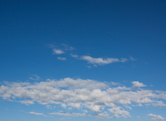 Blue sky with a bit of clouds.