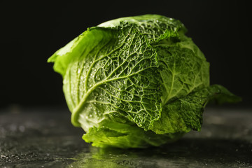 Fresh cabbage on dark background