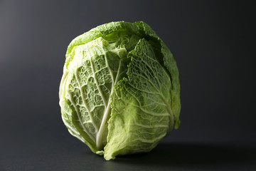 Fresh cabbage on dark background