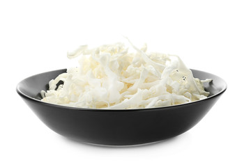 Plate with cut cabbage on white background