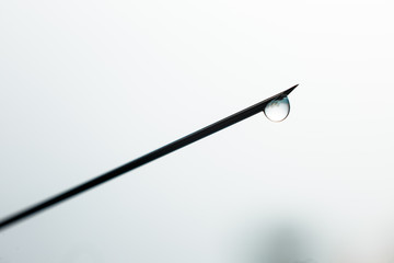 Close up Syringe needle medicine with liquid medicine drop