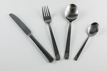 Cutlery with knife, fork, table spoon and little spoon