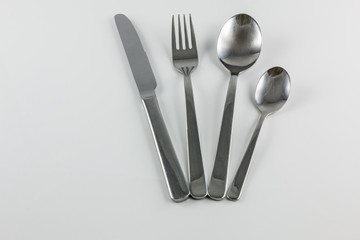 Cutlery with knife, fork, table spoon and little spoon