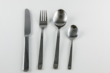 Cutlery with knife, fork, table spoon and little spoon