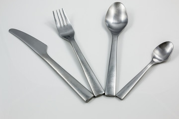 Cutlery with knife, fork, table spoon and little spoon