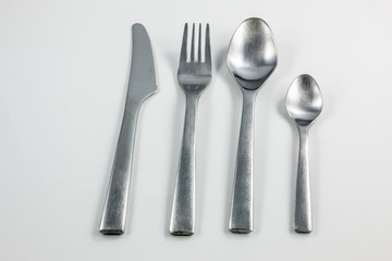 Cutlery with knife, fork, table spoon and little spoon