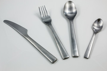 Cutlery with knife, fork, table spoon and little spoon