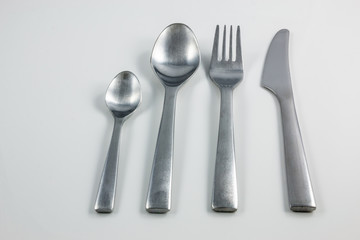 Cutlery with knife, fork, table spoon and little spoon