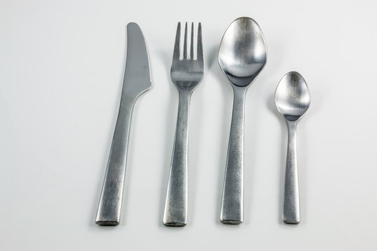 Cutlery with knife, fork, table spoon and little spoon