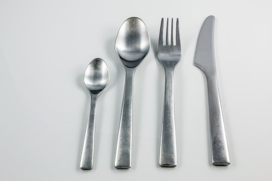 Cutlery with knife, fork, table spoon and little spoon