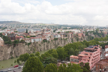 Fototapeta na wymiar Top view of the historical center of Tbilisi from Narikala fortress. Tbilisi is the capital of Georgia