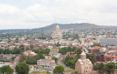 Fototapeta premium Top view of the historical center of Tbilisi from Narikala fortress. Tbilisi is the capital of Georgia