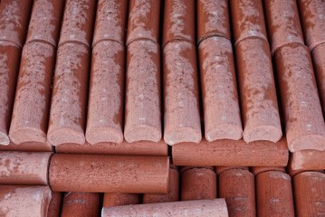 red texture of a long wet tile in a heap