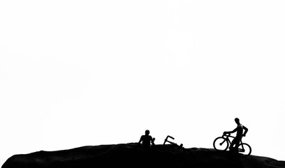 Fototapeta na wymiar Cyclist and Bicycle silhouettes on the white background