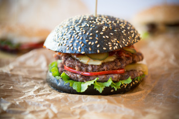 Black burger with thick beef meat